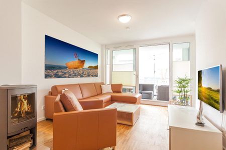 DünenResort Binz DünenResort Binz 424 Rügen - Wohn-Essbereich mit Couch