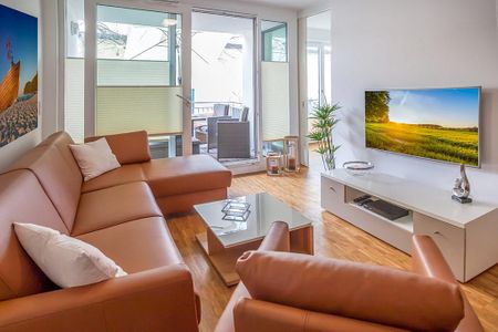 DünenResort Binz DünenResort Binz 424 Rügen - Wohn-Essbereich mit Couch