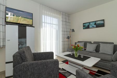 Strandschlösschen Strandschlösschen 17 Kühlungsborn - Wohn-Essbereich mit Couch