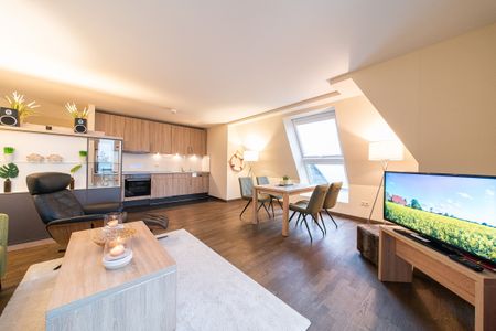 Resort Deichgraf Resort Deichgraf 31-20 Wremen - Wohn-Essbereich mit Couch