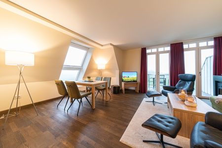 Resort Deichgraf Resort Deichgraf 31-20 Wremen - Wohn-Essbereich mit Couch