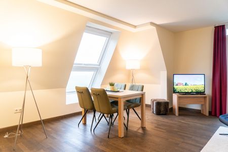 Resort Deichgraf Resort Deichgraf 31-20 Wremen - Wohn-Essbereich mit Esstisch und Sitzgelegenheit