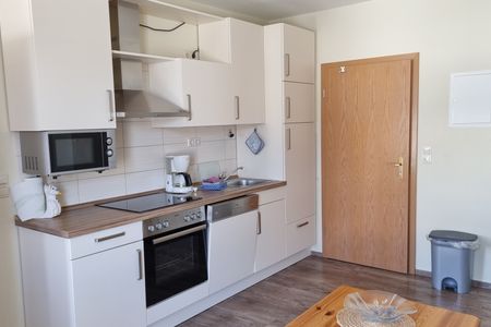 Haus Borkumitte Appartement Thor Haus Borkumitte - Wohnraum mit Küchenzeile