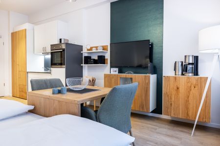 Ferienapartments am Krusespeicher Ferienapartments am Krusespeicher 1-12 Wismar - Wohn-/Schlafbereich mit Sitzgelegenheit