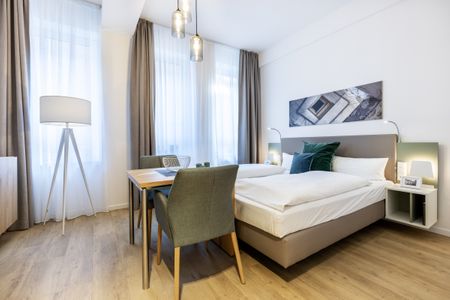 Ferienapartments am Krusespeicher Ferienapartments am Krusespeicher 2-21 Wismar - Wohn-/Schlafbereich mit Sitzgelegenheit