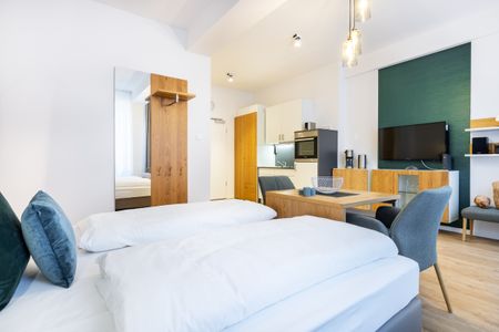 Ferienapartments am Krusespeicher Ferienapartments am Krusespeicher 2-24 Wismar - Wohn-/Schlafbereich mit Flatscreen-TV
