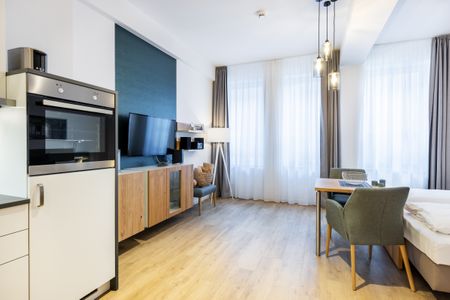 Ferienapartments am Krusespeicher Ferienapartments am Krusespeicher 2-24 Wismar - Wohn-/Schlafbereich mit Sitzgelegenheit