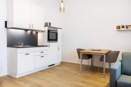 Ferienapartments am Krusespeicher Ferienapartments am Krusespeicher 3-25 Wismar - Wohn-/Essbereich mit Küchenzeile