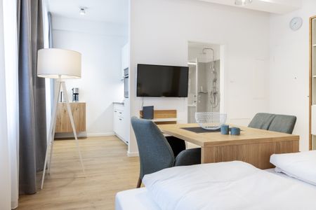 Ferienapartments am Krusespeicher Ferienapartments am Krusespeicher 0-03 Wismar - Wohn-/Schlafbereich mit Sitzgelegenheit