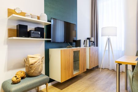 Ferienapartments am Krusespeicher Ferienapartments am Krusespeicher 2-23 Wismar - Wohn-/Schlafbereich mit Sitzgelegenheit