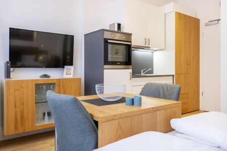 Ferienapartments am Krusespeicher Ferienapartments am Krusespeicher 3-27 Wismar - Wohn-/Schlafbereich mit Sitzgelegenheit