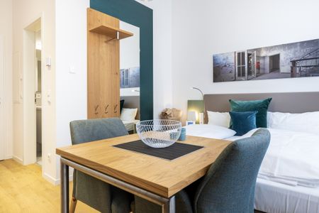 Ferienapartments am Krusespeicher Ferienapartments am Krusespeicher 3-27 Wismar - Wohn-/Schlafbereich mit Sitzgelegenheit