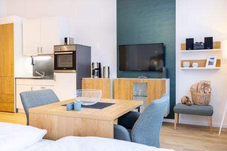 Ferienapartments am Krusespeicher Ferienapartments am Krusespeicher 3-31 Wismar - Wohn-/Schlafbereich mit Sitzgelegenheit
