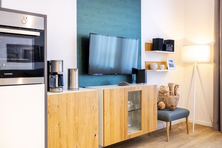 Ferienapartments am Krusespeicher Ferienapartments am Krusespeicher 3-31 Wismar - Wohn-/Schlafbereich mit Flatscreen-TV