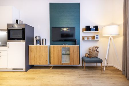 Ferienapartments am Krusespeicher Ferienapartments am Krusespeicher 3-31 Wismar - Wohn-/Schlafbereich mit Flatscreen-TV