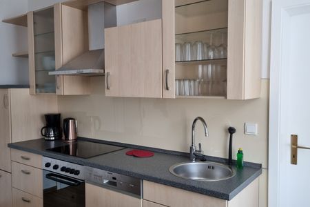 Haus Borkumitte Appartement Mellum Haus Borkumitte - Wohnzimmer mit Küchenzeile