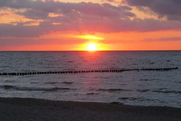 Strandbild mit Sonnenuntergang Residenz am Strand Wohnung 1-17