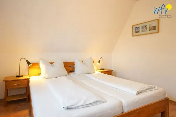 Schlafzimmer Ferienhaus Seehundje Ferienwohnung 21