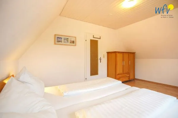 Schlafzimmer Ferienhaus Seehundje Ferienwohnung 21