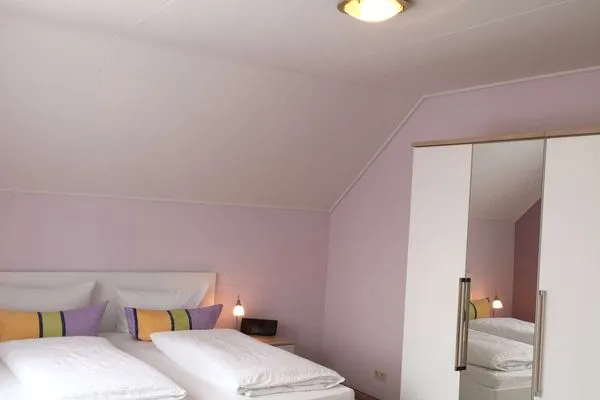 Schlafzimmer Ferienhaus Kiebitzdüne Ferienwohnung Auster