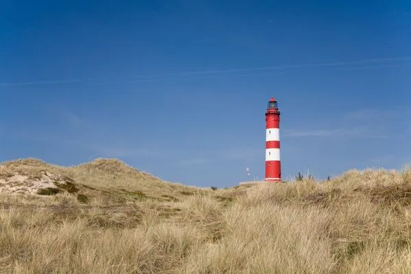 Amrumer Leuchtturm in den Inseldünen Amrumer Welle Ferienwohnung „Aalto"