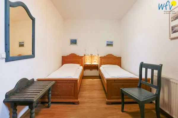Schlafzimmer Weisses Rössl Ferienwohnung Wellenreiter
