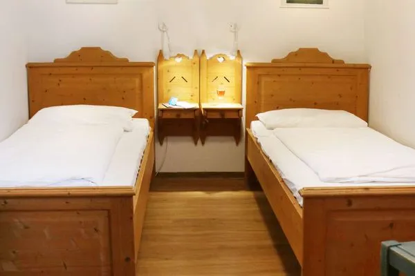 Schlafzimmer Weisses Rössl Ferienwohnung Wellenreiter