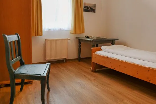 Schlafzimmer Weisses Rössl Ferienwohnung Wellenreiter