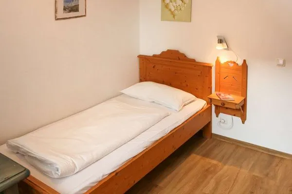 Schlafzimmer Weisses Rössl Ferienwohnung Wellenreiter