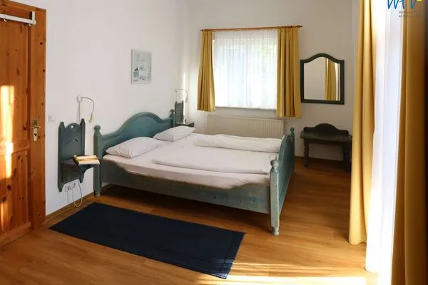 Schlafzimmer Weisses Rössl Ferienwohnung Seepferdchen