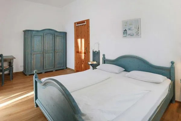 Schlafzimmer Weisses Rössl Ferienwohnung Seepferdchen
