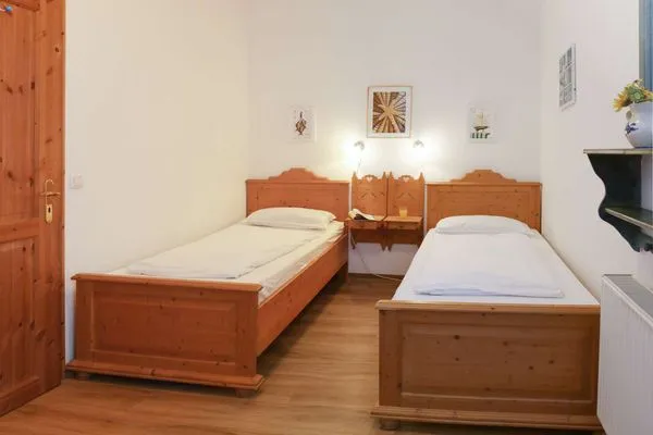 Schlafzimmer Weisses Rössl Ferienwohnung Seepferdchen