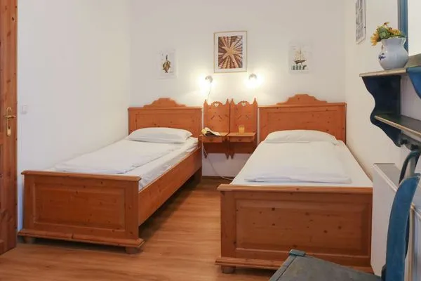 Schlafzimmer Weisses Rössl Ferienwohnung Seepferdchen