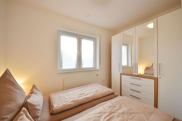  Ferienwohnung Mittelpunkt - Haus Mittelpunkt Wangerooge - Schlafzimmer