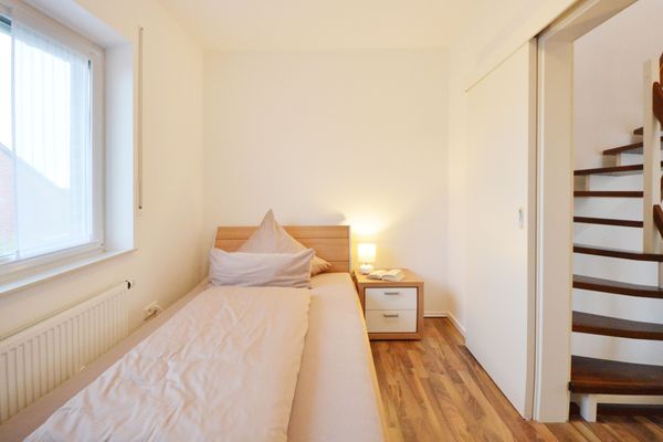  Ferienwohnung Mittelpunkt - Haus Mittelpunkt Wangerooge - Schlafzimmer