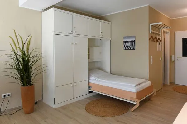 Wohnraum mit Schrankbett Haus Bahnhofstraße 11a Ferienwohnung 7