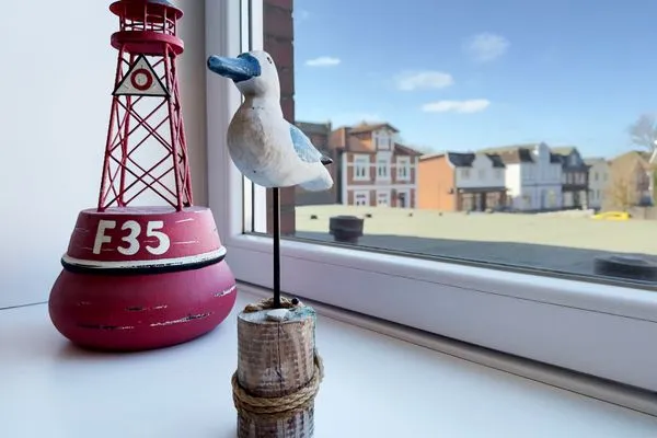 Dekoratives Detail Haus Nordenlicht Ferienwohnung „Willkommen bei den Hartmanns"