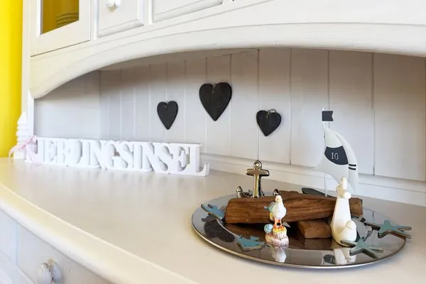 Dekoratives Detail Haus Nordenlicht Ferienwohnung „Willkommen bei den Hartmanns"