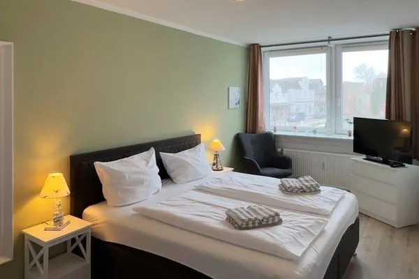 Schlafzimmer 2 der Ferienwohnung "Willkommen bei den Hartmanns" in Wittdün auf Amrum Haus Nordenlicht Ferienwohnung „Willkommen bei den Hartmanns"