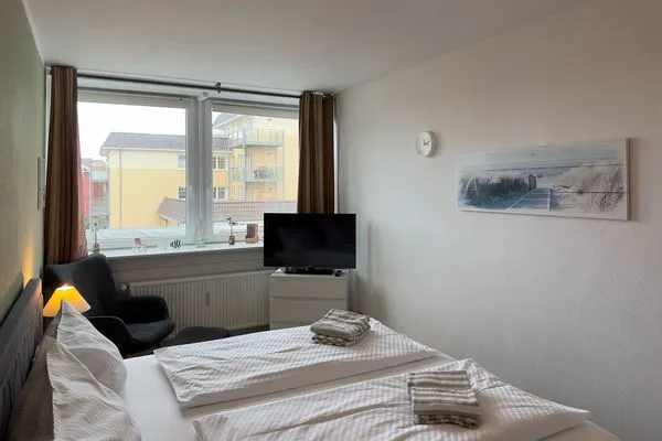 Schlafzimmer 2 der Ferienwohnung "Willkommen bei den Hartmanns" in Wittdün auf Amrum Haus Nordenlicht Ferienwohnung „Willkommen bei den Hartmanns"