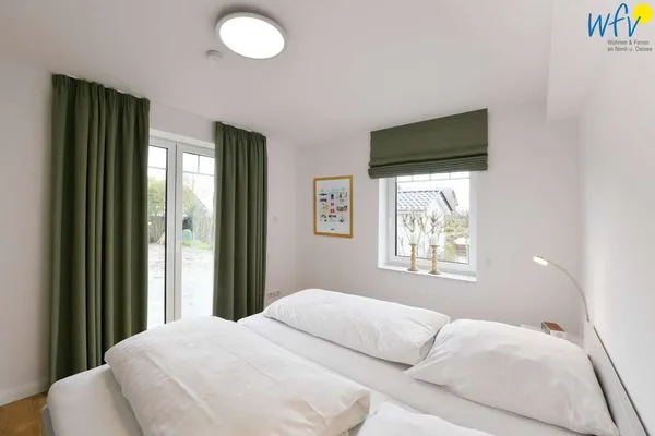Schlafzimmer Haus im Dorfgroden 14 Ferienwohnung Muschelsucher