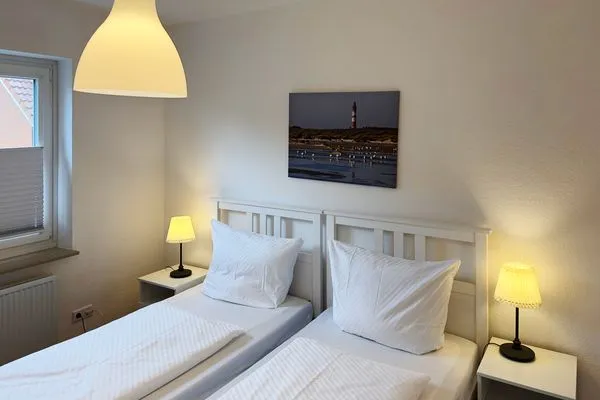 Schlafzimmer der Ferienwohnung Strandlöper in Wittdün auf Amrum Huus Heverknob Ferienwohnung *Strandlöper*