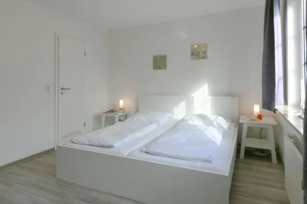 Schlafzimmer Familienhaus im Dorfgroden 27 Ferienwohnung Zugvogel