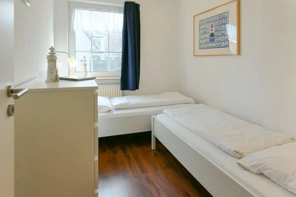 Schlafzimmer Familienhaus im Dorfgroden 27 Ferienwohnung Zugvogel