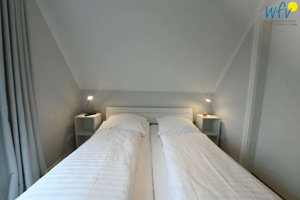 Schlafzimmer Bootshaus in den Dünen - 4 Ferienwohnung Sonnendeck