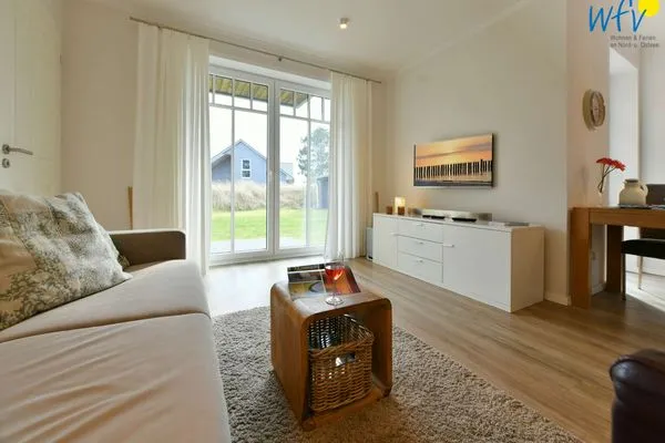 Wohnzimmer Bootshaus in den Dünen - 5 Ferienwohnung Dünengeflüster