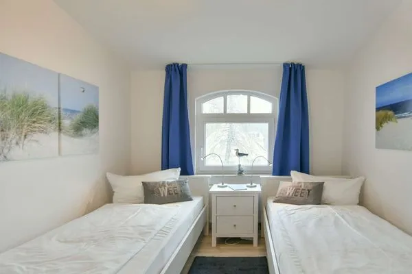 Schlafzimmer Villa Kranich Ferienwohnung 9