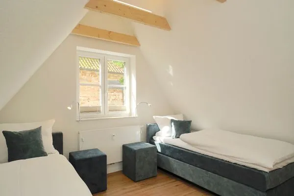 Schlafzimmer  Ferienhaus 'Lütt Huus' für bis zu sechs Personen im historischen Stadtkern von Schleswig