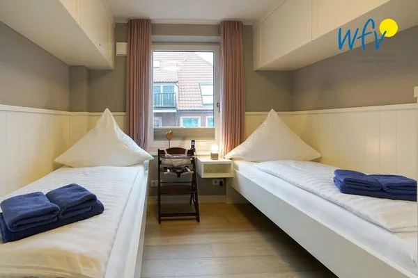 Schlafzimmer Achterhus Ferienwohnung Wattwurm