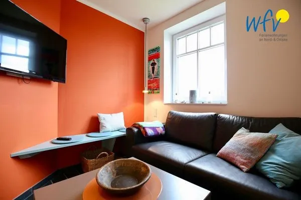 Wohnzimmer Bootshaus in den Dünen - 1 Ferienwohnung "Unter Fischen"